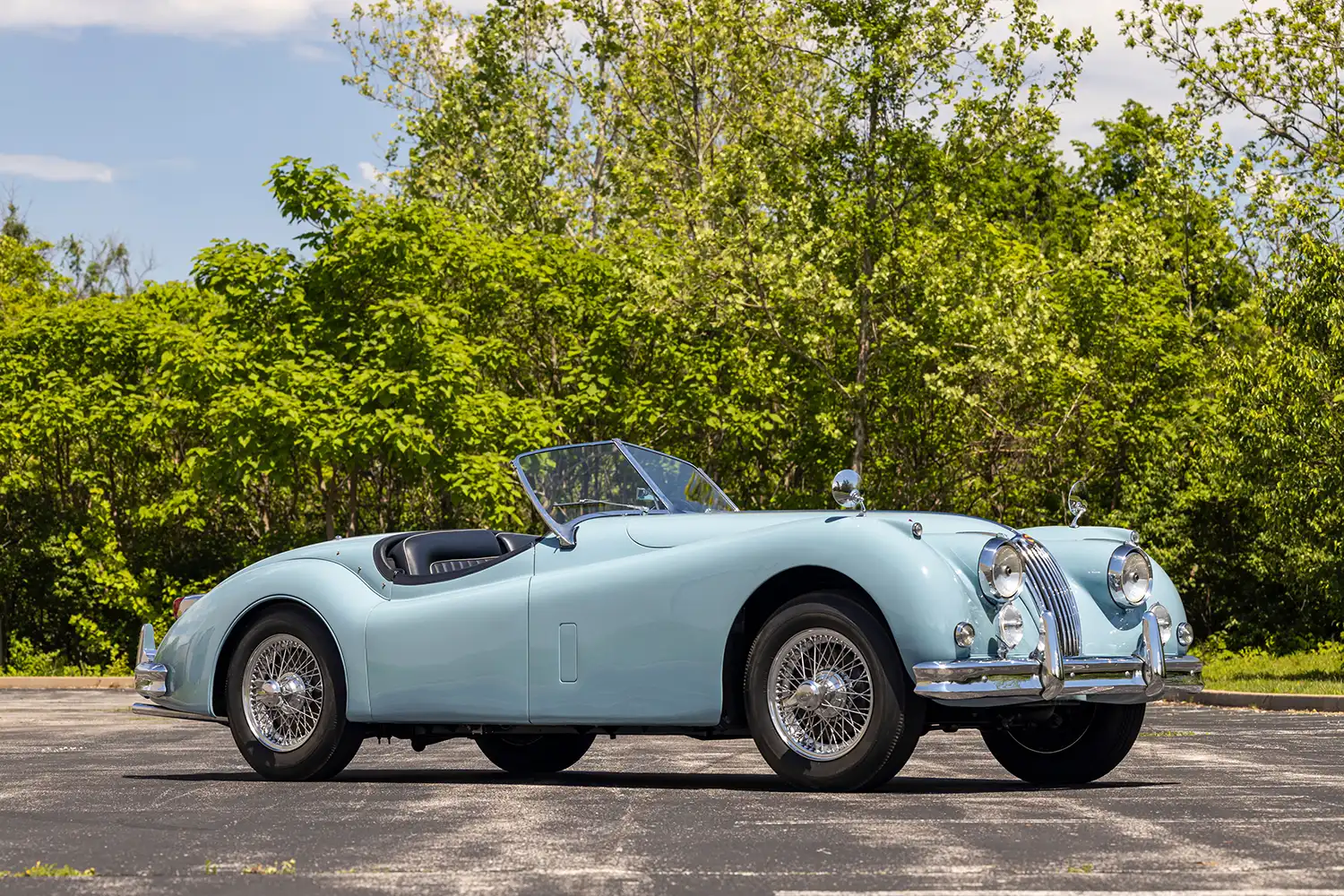 Step into Elegance with a 1955 Jaguar XK 140 MC Roadster