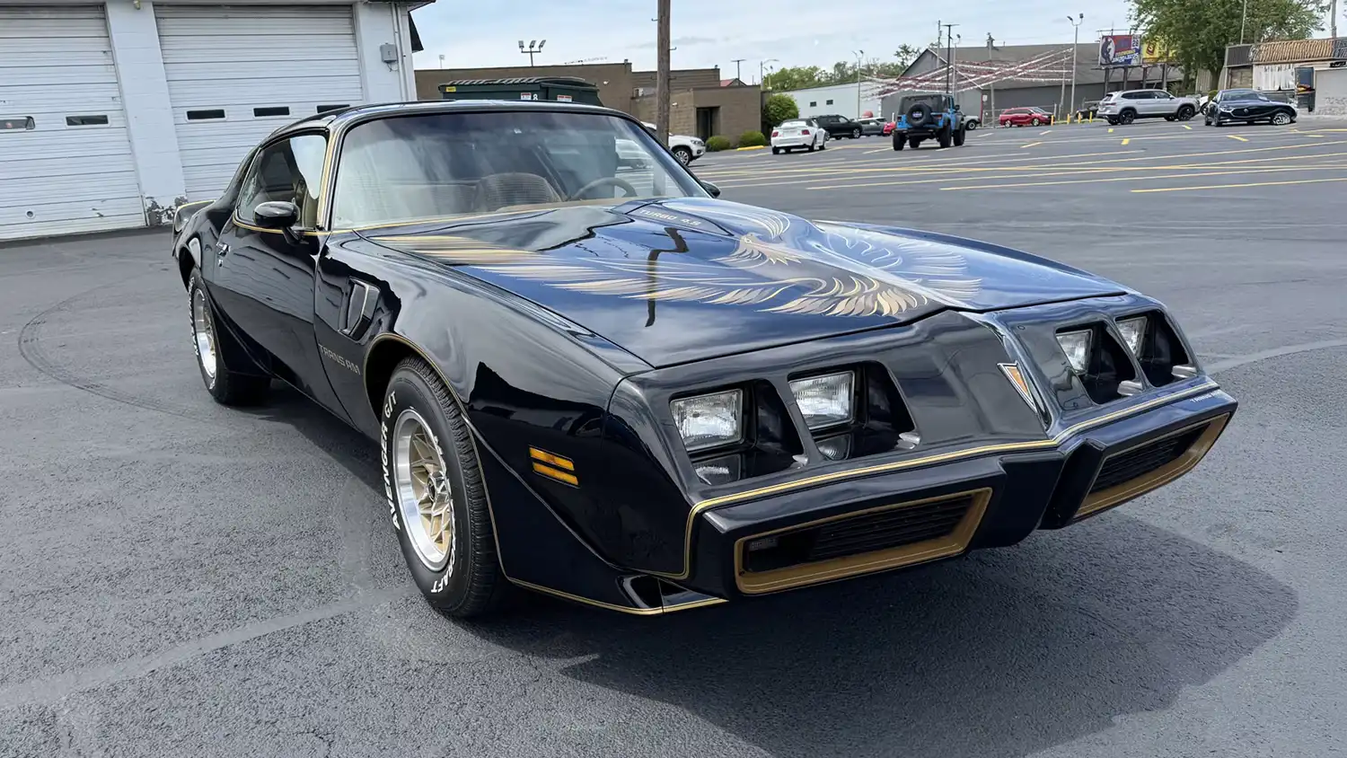 A Black and Gold 1980 Pontiac Turbo Trans Am SE Coupe